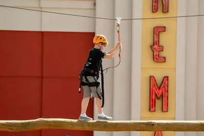 boy trying loggersports at adventure park in pigeon forge